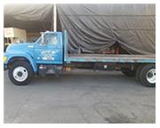 Ford #F700, 185, 059 miles, automatic, flat bed truck, 8 cyl., FWD drive, 8' x 20' bed, 1996, #A5169