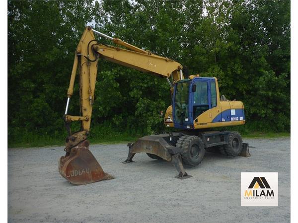 2005 Caterpillar M315C w/ Plumbing on Stick & Stablizers - Stock Number 2005 Caterpillar M315C w/ Plumbing on Stick & Stablizers - Stock Number
